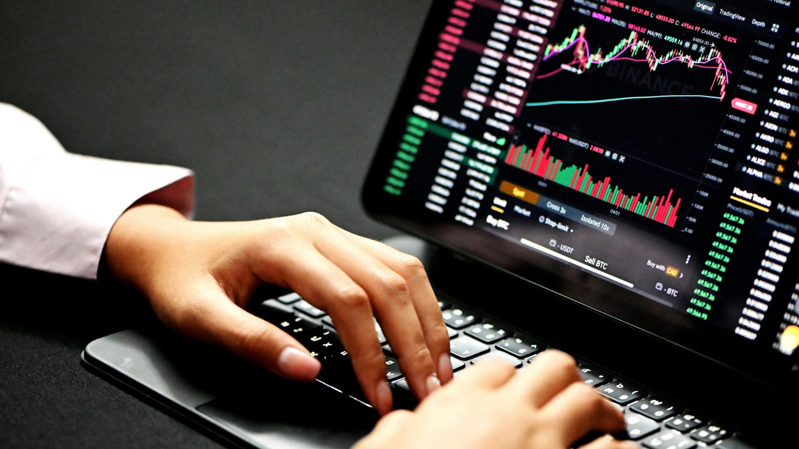 typing laptop, the screen shows an graph digital marketing and web design specialist in Kerala this is my focus keyword