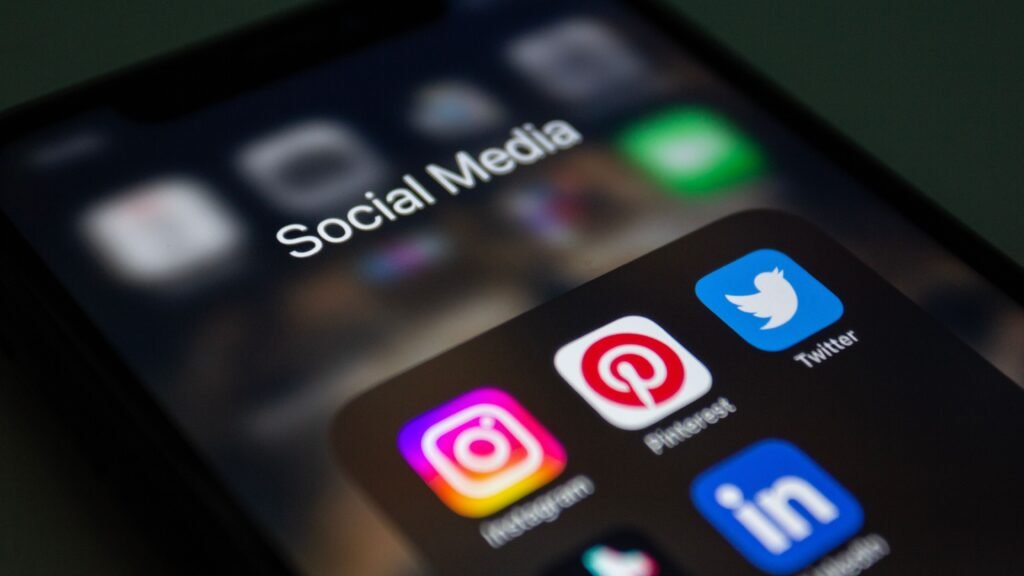 A smartphone screen displaying popular social media applications like Instagram and Twitter.digital marketing and web design specialist in Kerala this is my focus keyword